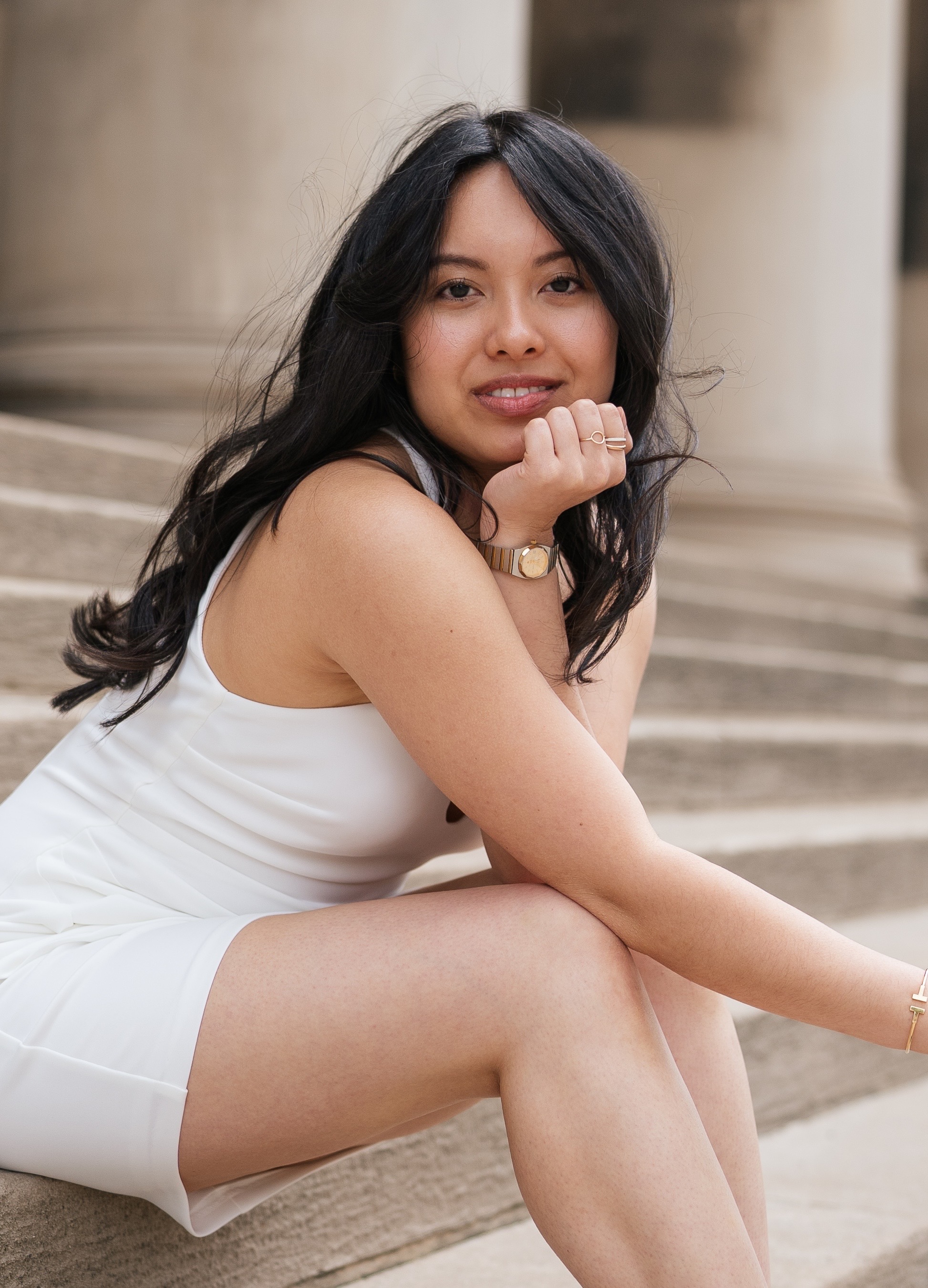 Dr. Tien Nguyen seated on stone steps
